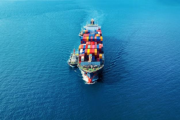 A container ship seen from above, crossing open water